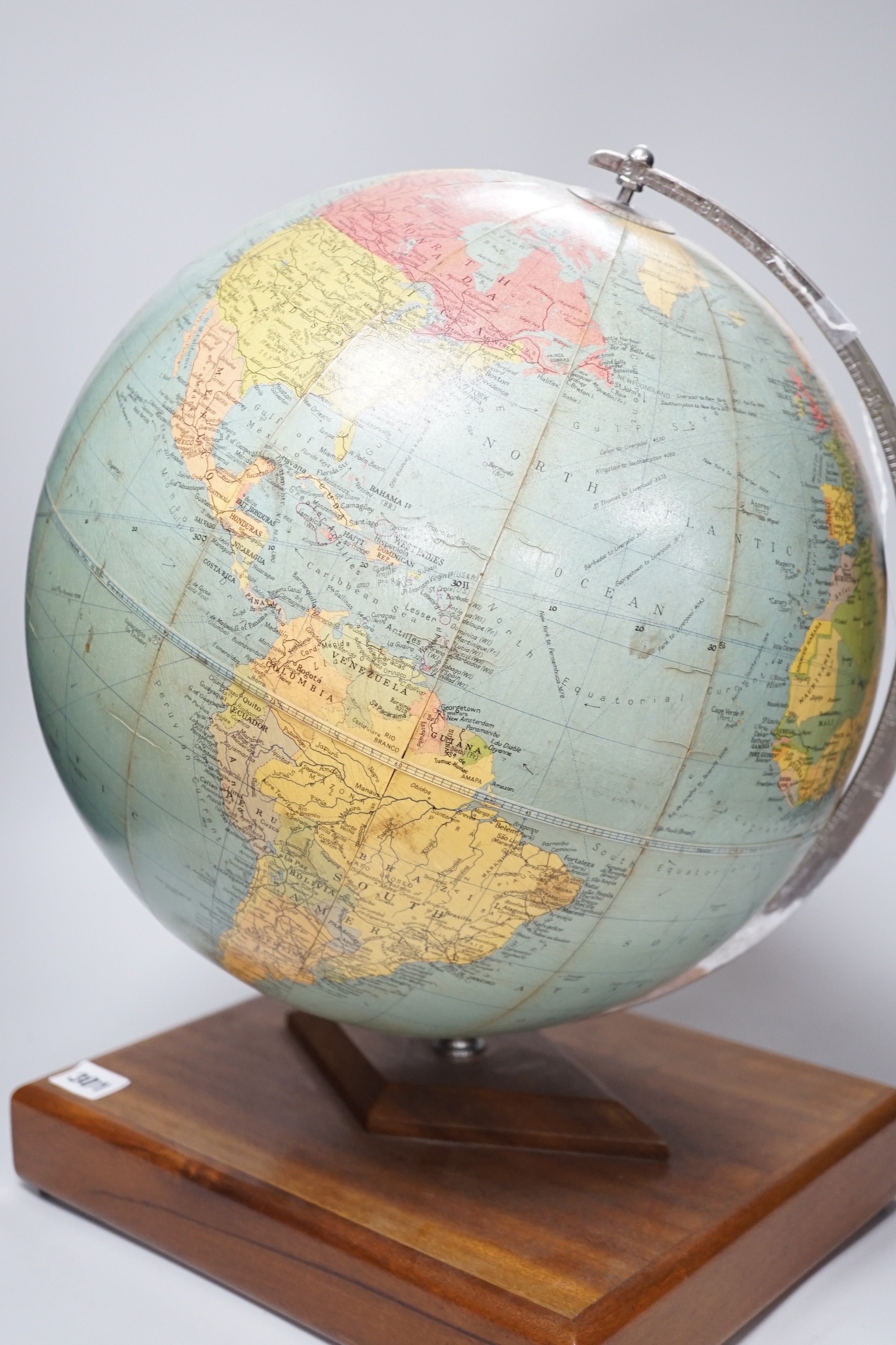 A Philips Challenge Globe, on stand, 46cm high, with atlas